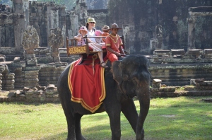 Zoe on an elephant at Angkor Wat
